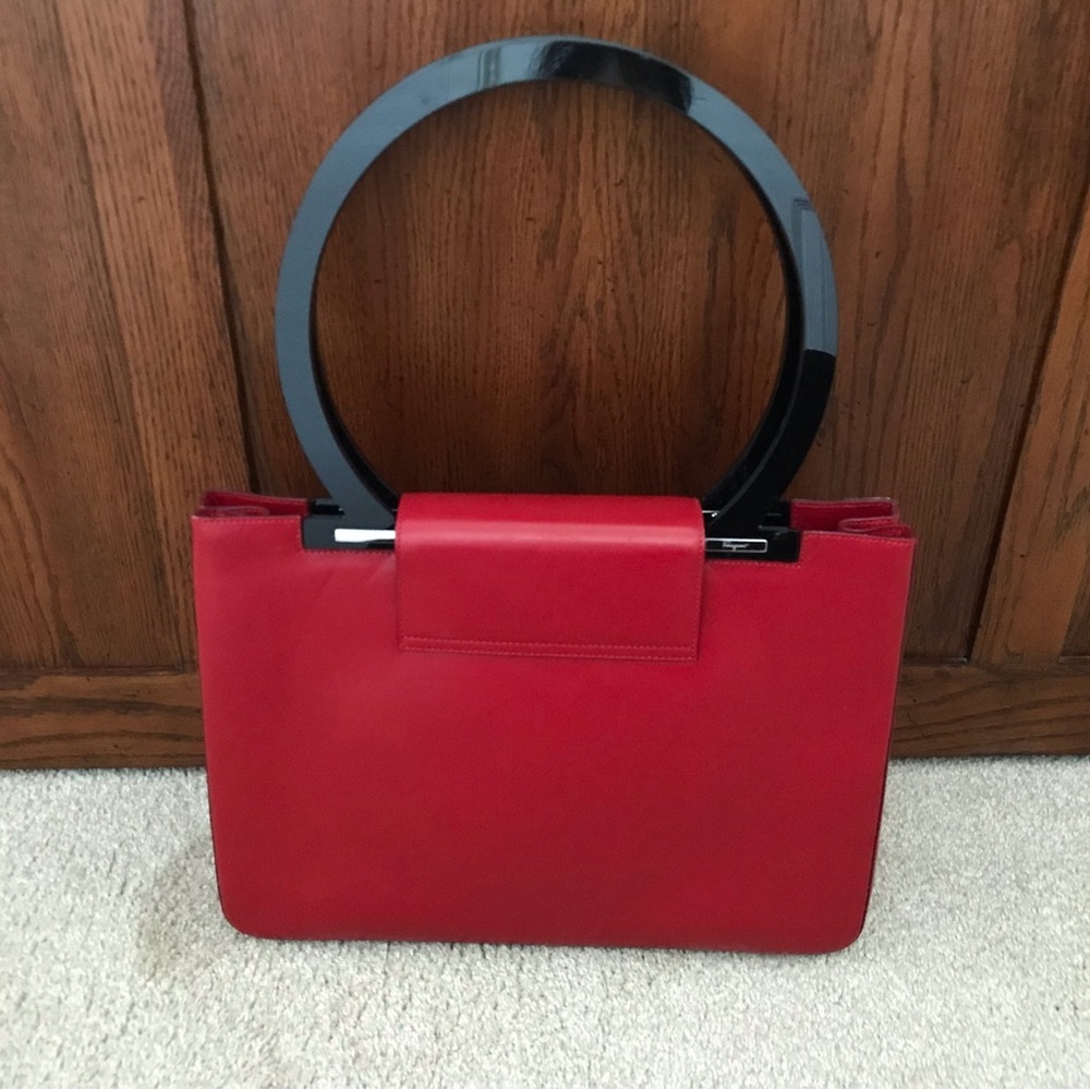 Salvatore Ferragamo Red Leather purse with round black handles. Rare find.